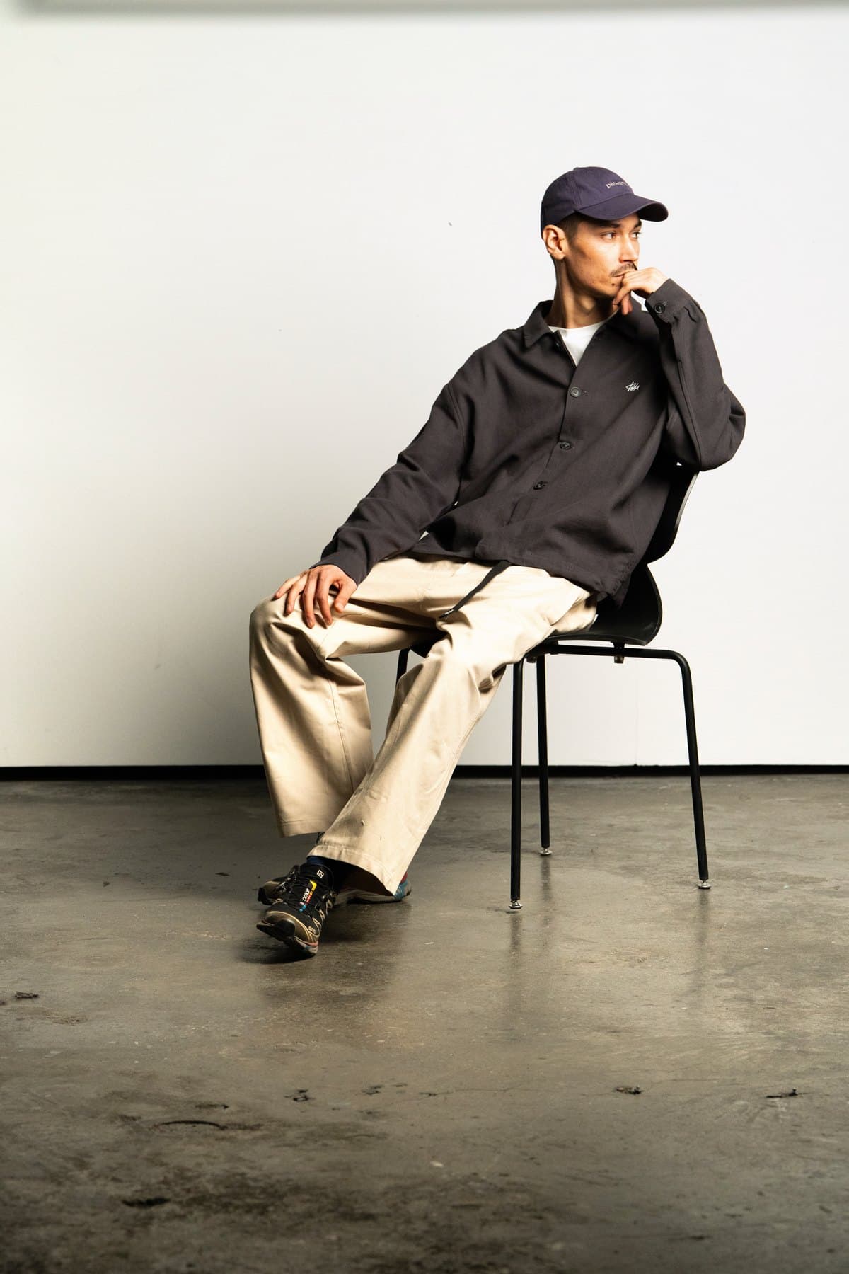 Black Coach Jacket — On model, seated