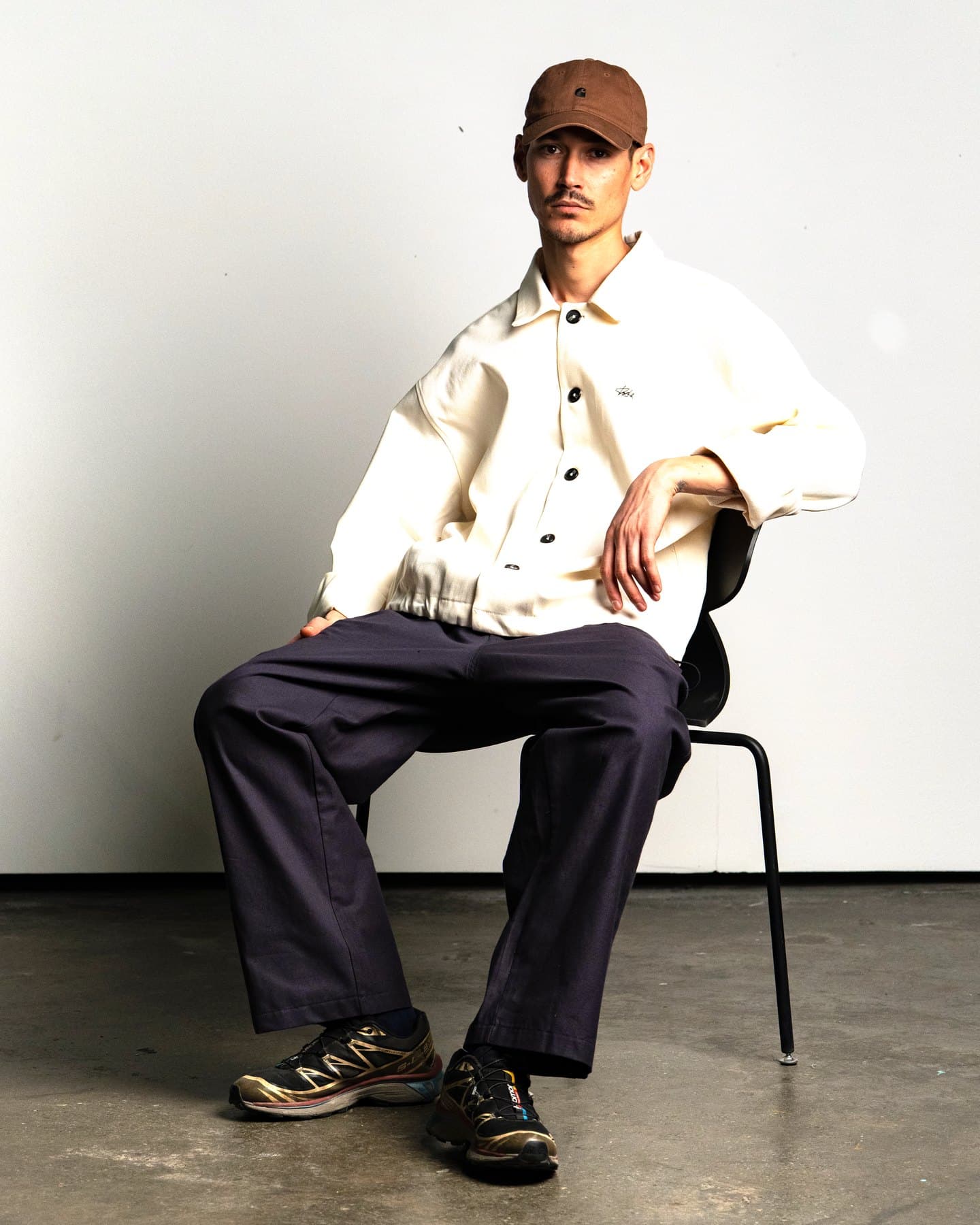 Ecru Coach Jacket — On model, seated