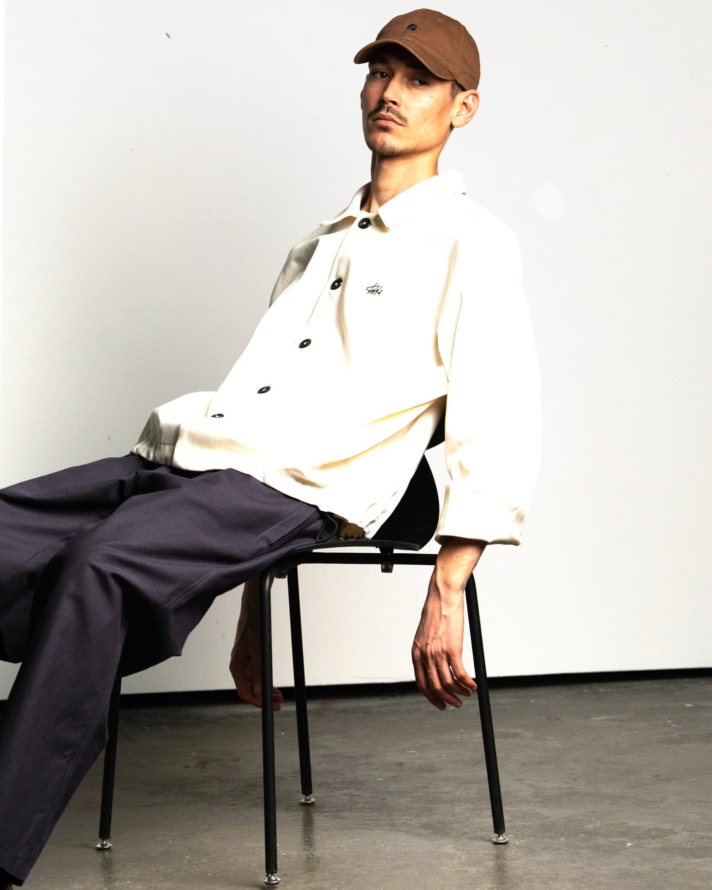 Ecru Coach Jacket — On model, seated