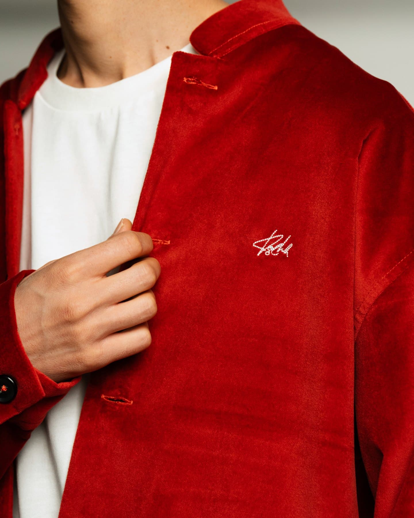 Red Coach Jacket — Chest detail